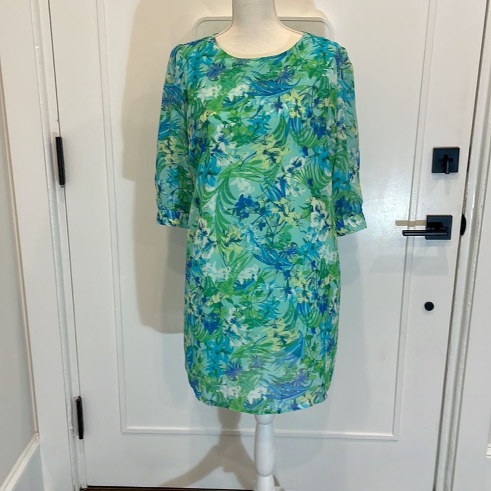 Bright green, blue, yellow dress.
